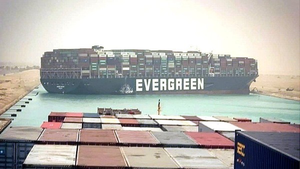 The container ship Ever Given is seen stuck in the Suez Canal, blocking all traffic. [Source: BBC, EPA]
