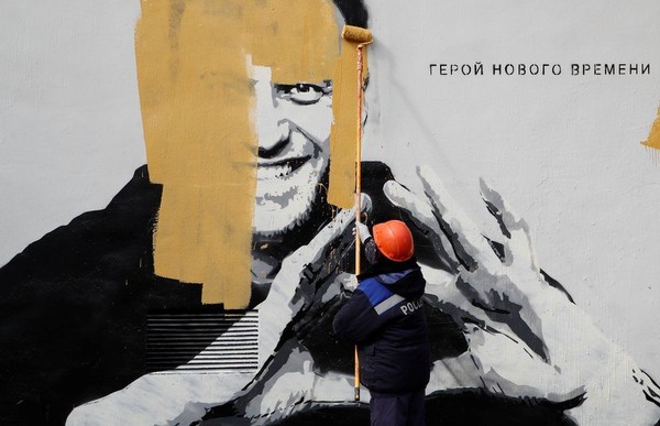 Workers are painting over Navalny mural