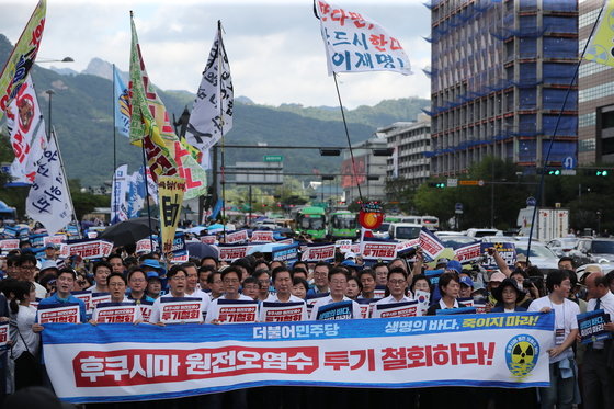 South Koreans gathered in Seoul to protest Japan’s discharge of treated radioactive water.