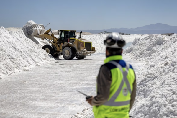 Lithium mine workers move salt byproduct at a lithium mine in the Atacama Desert in Salar de Atacama, Chile. (John Moore/Getty Images) (from an article on cbc.ca).